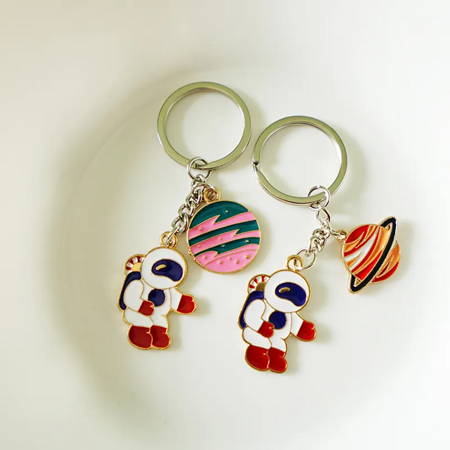 الجملة شعار مخصص المينا سلاسل المفاتيح المعدنية مفتاح سلسلة لطيف رائد فضاء المفاتيح